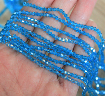 light blue 2mm glass bicone beads