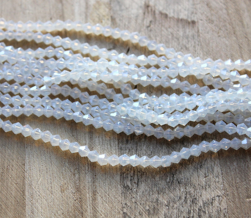 4mm Glass Bicones ~ Lustred Opalite ~ approx. 87 beads/string