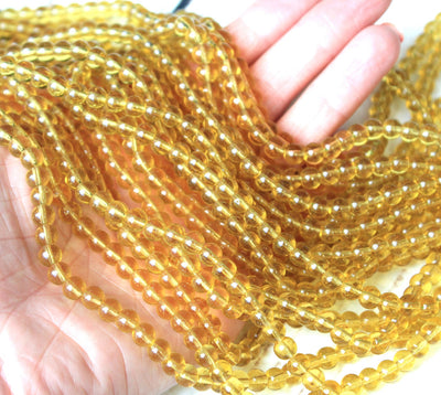 1 Strand of 6mm Glass Beads ~ Transparent Light Gold ~ approx. 50 beads