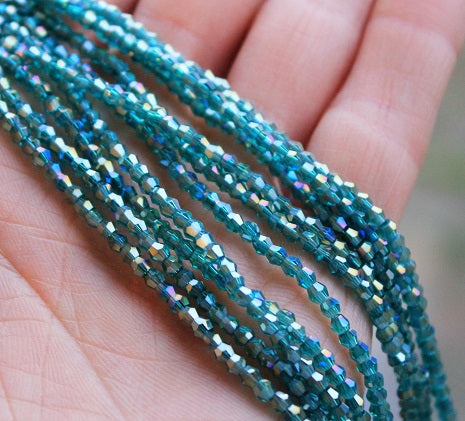 1 Strand of 2mm Glass Bicones ~  Teal AB ~ approx. 200 beads