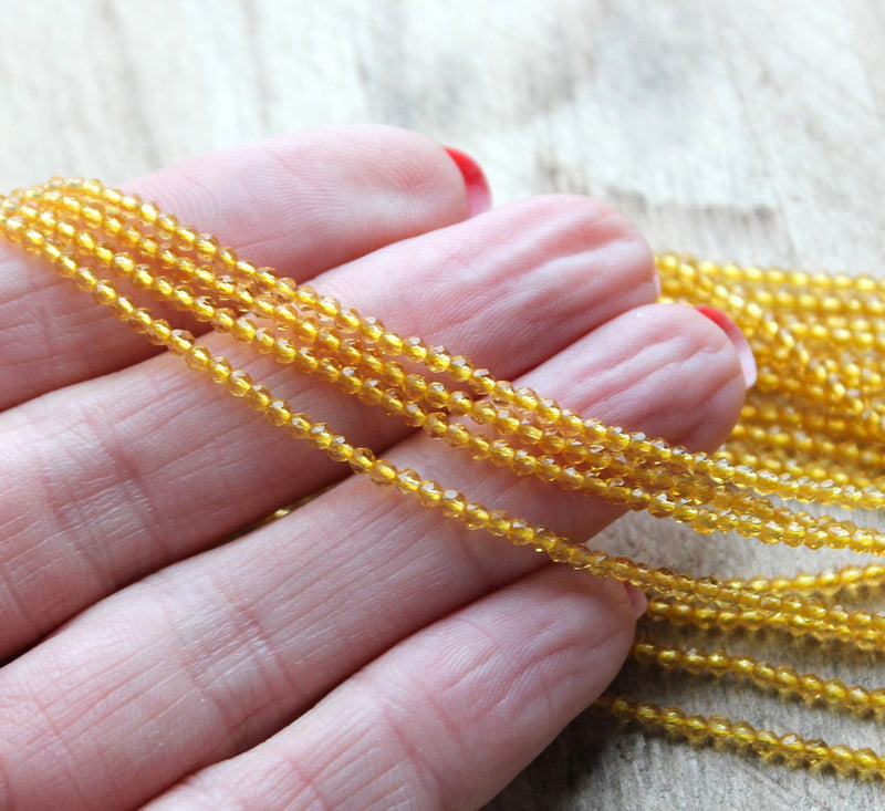 2mm Round Faceted Glass Beads ~ Gold ~ approx. 180 beads / string