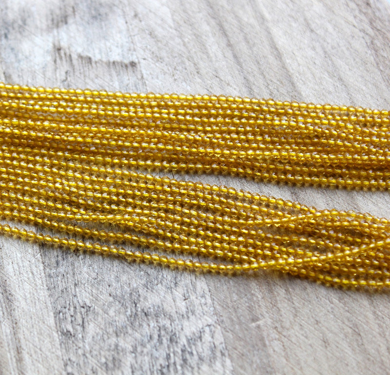 2mm Round Faceted Glass Beads ~ Gold ~ approx. 180 beads / string