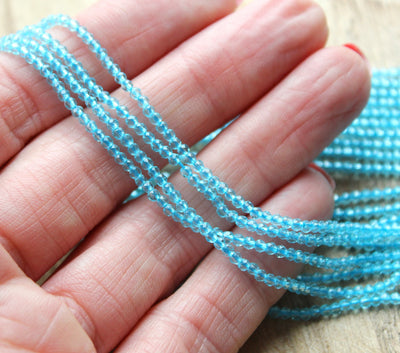 2mm Round Faceted Glass Beads ~ Light Blue ~ approx. 180 beads / string