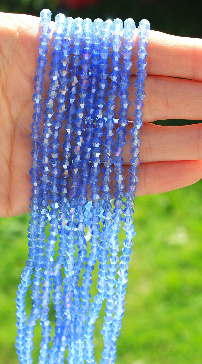 4mm Crystal Glass Bicones ~ Lustred Light Sapphire ~ approx. 70 beads/string