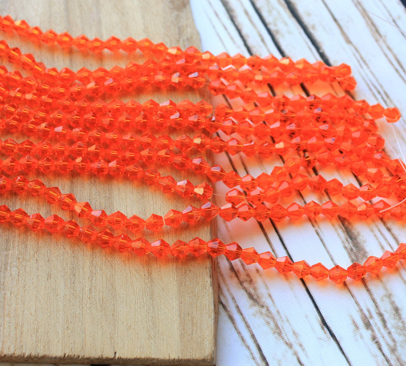 A Grade 4mm Glass Bicones ~ Orange ~ approx. 85 beads/string