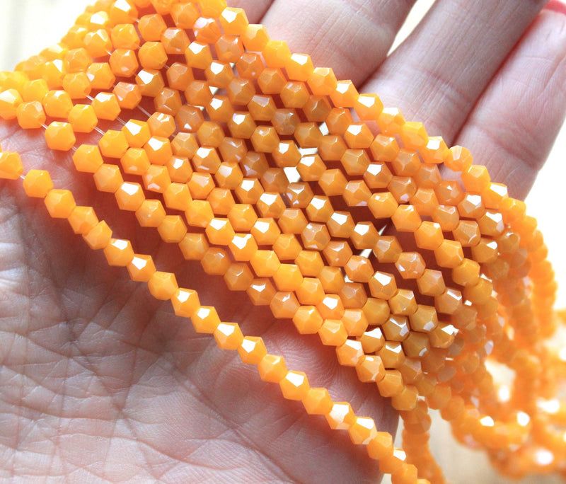 The Bead Store 4mm Glass Bicones ~ Opaque Lustred Light Orange ~ approx. 85 beads/string