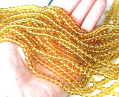 The Bead Store 6mm Glass Beads ~ Transparent Light Gold ~ approx. 50 beads