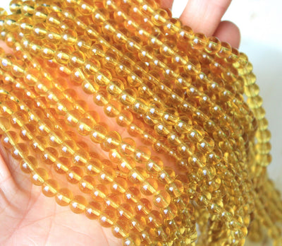 The Bead Store 6mm Glass Beads ~ Transparent Light Gold ~ approx. 50 beads