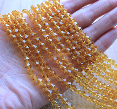 The Bead Store 6mm Glass Bicones Gold 