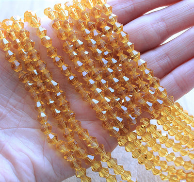 The Bead Store 6mm Glass Bicones Gold 