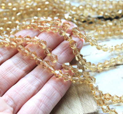 The Bead Store 6mm Glass Bicones Light Gold 