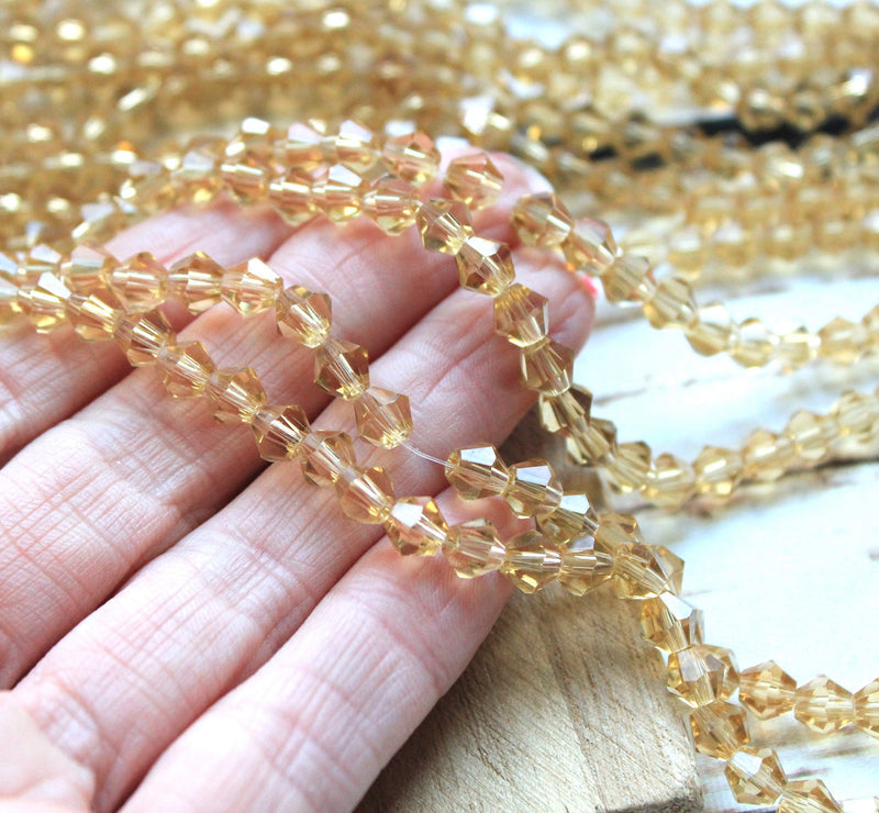 The Bead Store 6mm Glass Bicones Light Gold 