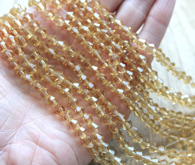 The Bead Store 6mm Glass Bicones Light Gold 