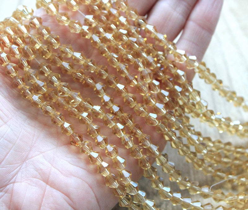 The Bead Store 6mm Glass Bicones Light Gold 