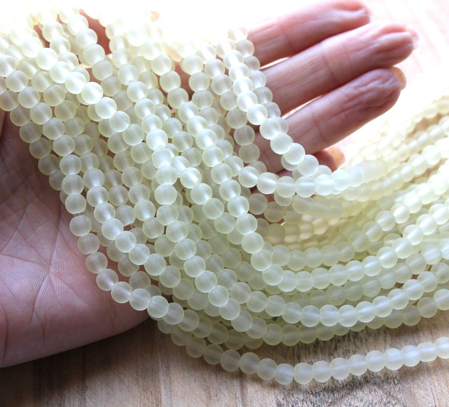 The Bead Store 6mm Round Frosted Glass Beads Light Champagne approx