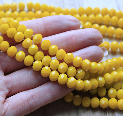 The Bead Store 8x6mm Faceted Glass Rondelle Beads Opaque Yellow 65 beads string