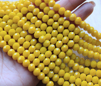 The Bead Store 8x6mm Faceted Glass Rondelle Beads Opaque Yellow 65 beads string
