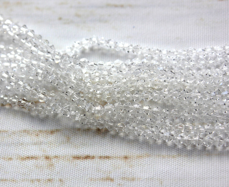 The Bead Store Crystal Clear 3mm Glass Bicones  110 Beads / String