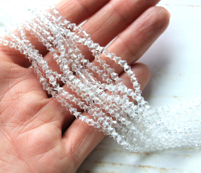 The Bead Store Crystal Clear 3mm Glass Bicones  110 Beads / String